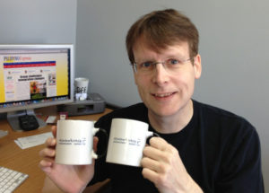 Paul Morrow, designer of the first Baybayin font, and the mug he created for us